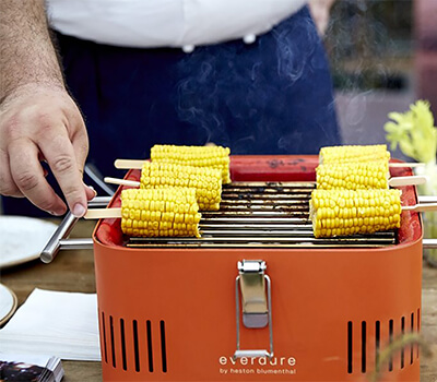 Image of Everdure Cube Portable Charcoal BBQ in Orange