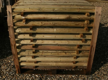 Image of Pack of 10 1.2m (4ft) tall, 50mm diameter treated Wooden Fence Posts