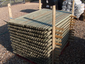 Image of 10 x 1.8m tall x 40mm diam. round wooden fence posts stakes pressure treated