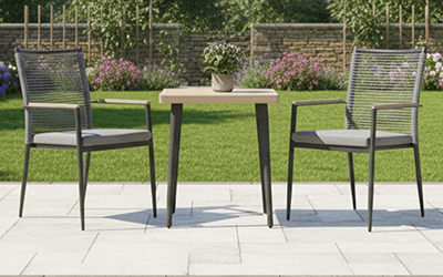 Image of Merano Bistro with a rope back and light grey frame with a folie wood effect table.