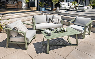 Hartman Alora 3 seat lounge set. Positioned on a stone patio, with a house with French doors in the background