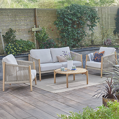 Studio image of Naples Lounge Set, with wooden frame and rope seating areas, coffee table and cream cushions