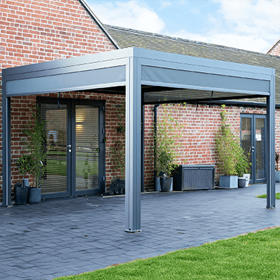 Garden with a Belfort pergola on back of a house
