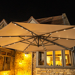 Extra image of Kettler Orion 3.0m Round LED Cantilever Parasol with Side Tilt, Granite Base & Night Cover - Grey Frame / Slate Canopy